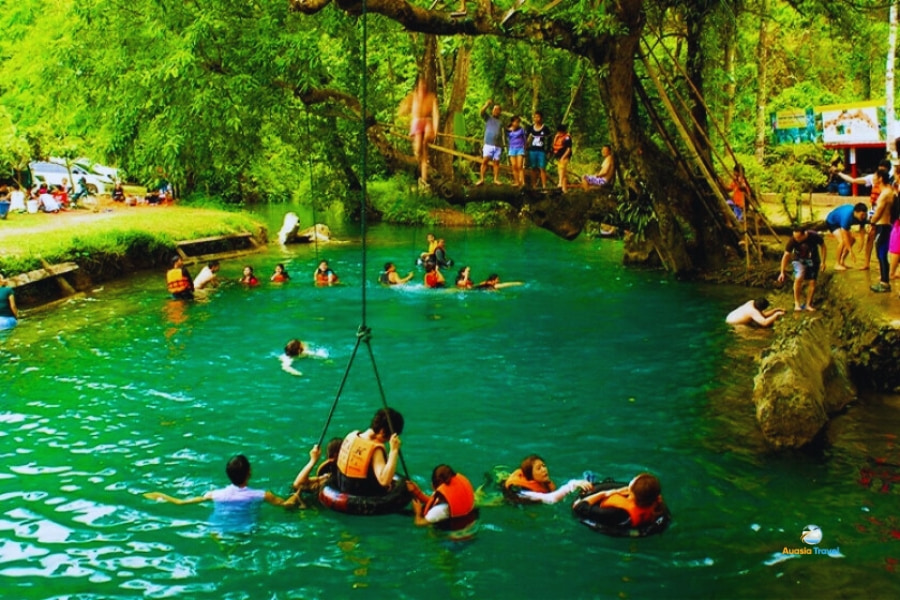 Tourists swimming at Blue Lagoon in Vang Vieng Laos – Auasia Travel
